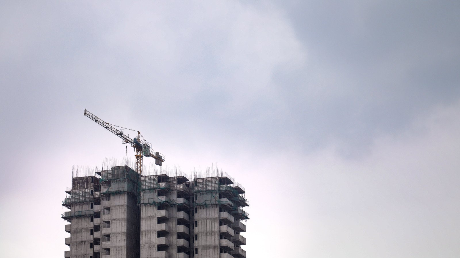 A high-rise residential building under construction in India, representative of projects facing RERA possession-delay disputes.