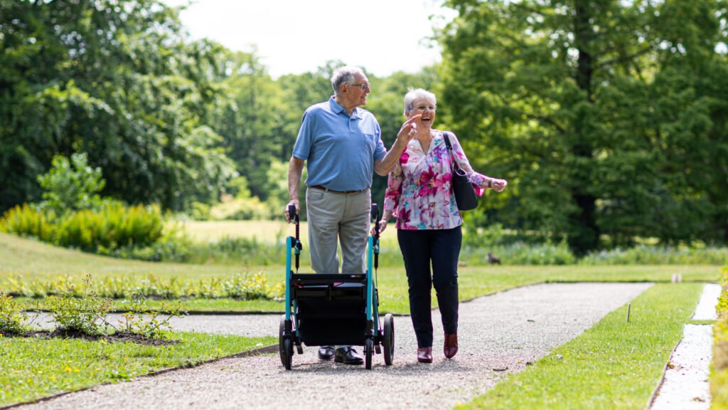 A senior-friendly community garden walkway, representative of independent-living style senior communities compared across Delhi-NCR and Goa.
