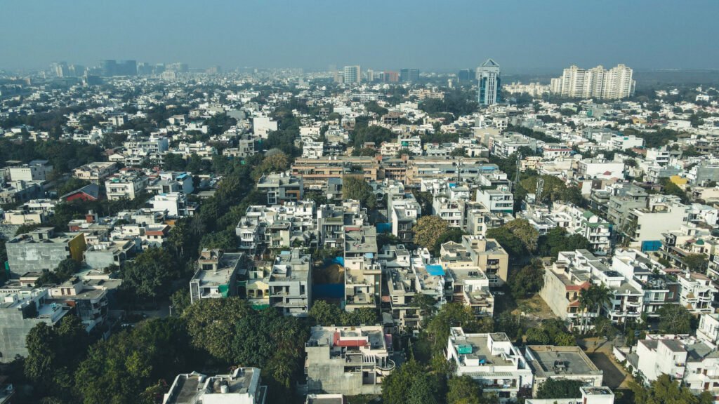 Dense residential buildings in Gurugram, Haryana, representative of the independent-floor and plotted-colony market affected by the 2026 stilt-plus-four approval freeze