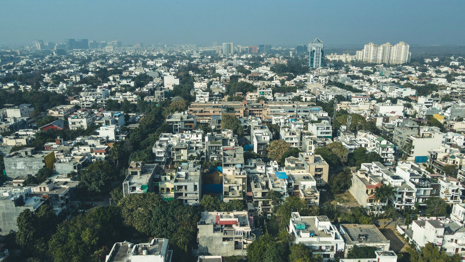 Dense residential buildings in Gurugram, Haryana, representative of the independent-floor and plotted-colony market affected by the 2026 stilt-plus-four approval freeze